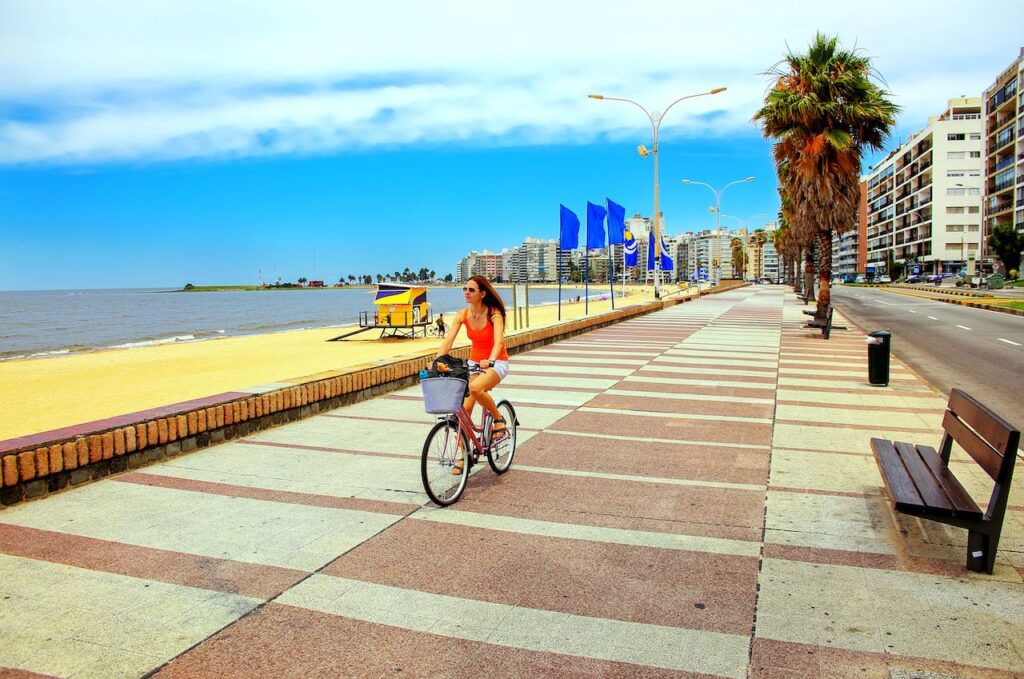 Woman Biking On The Boulevard Along Pocitos Beach In Montevideo Uruguay 1024x679